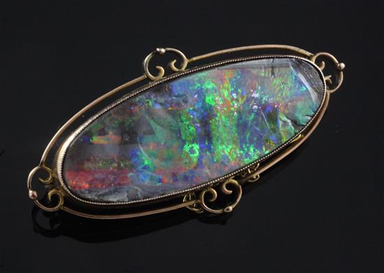 An Edwardian 9ct gold and black opal brooch, 51mm.